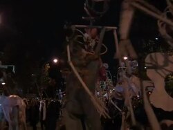 Large skeletons come down the parade route of the NYC Halloween parade Stock Footage