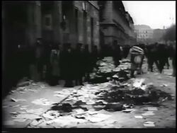 B/W 1956 people burning piles of Soviet books in street during Hungarian revolution / newsreel Stock Footage
