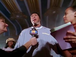 Low angle video camera point of view hip hop star being interviewed / wide shot press gathered around star Stock Footage