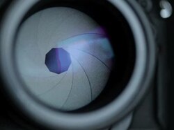 ECU Shot of aperture of photo camera closes and opens during shooting / Ibiza, Balearic Islands, Spain  Stock Footage