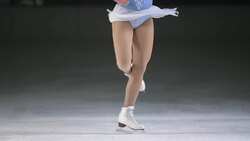 SLO MO LD Female figure skater performing one foot spin Stock Footage