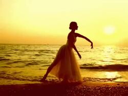 ballerina dancing on the beach Stock Footage
