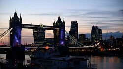 London Tower Bridge with skyline in the night Stock Footage