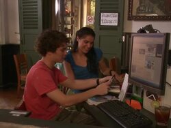 MS ZI Young couple looking at photos in internet cafe, Bangkok, Thailand Stock Footage