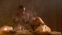 Two dwarf men in ancient Egypt smelt ore in a clay pot over a fire. Stock Footage