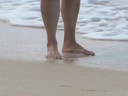 Feet in the ocean waves Stock Footage