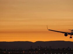 HD modern airplane landing in sunset Stock Footage