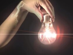 lightbulb in hand of humanoid Stock Footage