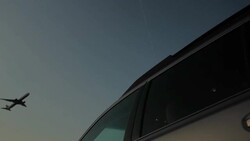Plane Flying over a parked car Stock Footage
