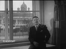 1952: ALLIED-OCCUPIED VIENNA: WS Austrian chancellery, Angled WS Front door, WS Former Chancellor Leopold Figl (1902-1965) by window talking, CU Leopold Figl SOT speaking German, thanking Americans for helping Austria, occupation is a great burden. Instructional Video