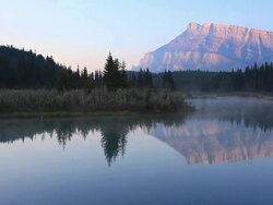 Reflection of  Mount Rundle on lake, Banff National Park Stock Footage