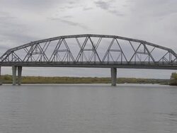 WS Steel bridge collapsing  into river and birds flying off  / Bismarck, North Dakota, USA Stock Footage