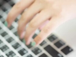 Hand typing a laptop computer Stock Footage