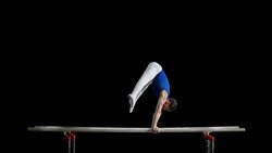 SLO MO Gymnast doing a handstand on parallel bars Stock Footage
