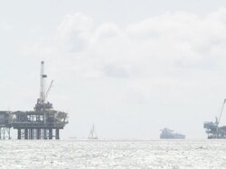 Oil Drilling Rigs with Sail Boat Stock Footage