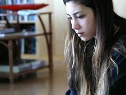 Looking down at papers then typing Stock Footage