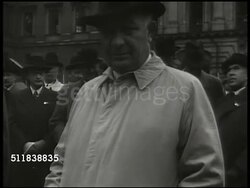 1943: OUTDOOR CEREMONY: Swedish Prime Minister Per Albin Hansson (1885-1946) w/ men standing BG. Adults waving hats outside building. PM Per Albin Hansson shaking hands w/ King Gustov V Instructional Video