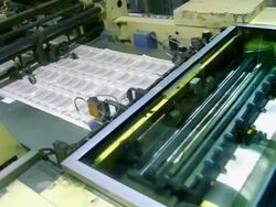 MS, Sheets of American five dollar bills moving fast on conveyor, Washington DC, USA Stock Footage