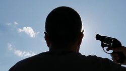 Man Is Trying To Commit Suicide With Revolver Gun Under Bright Sunlight Stock Footage