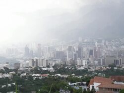 WS PAN View of cityscape located near mountain / Caracas, Venezuela Stock Footage