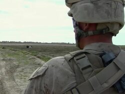 February 2009 WS Soldier standing in field / Bakwa, Farah Province, Afghanistan Stock Footage