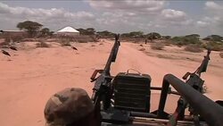 Government soldiers on patrol to defend aid workers from militants Instructional Video