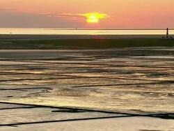 WS AERIAL POV ZI PAN View of lighthouse  / Westerheversand, Schleswig-Holstein, Germany Stock Footage