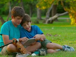 HD: Boys Playing on a Tablet Device Stock Footage