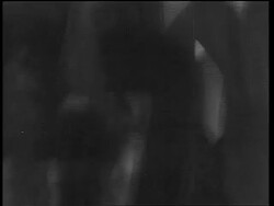 B/W 1933 close up tilt up man in formalwear shaking drink in cocktail shaker / end of Prohibition Stock Footage