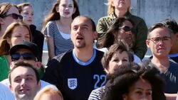 MS Group of friends watching soccer match in stadium Stock Footage
