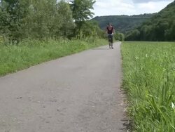 WS Woman in-line skating / Saarburg, Saar-Valley, Rhineland-Palatinate, Germany Stock Footage