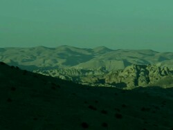 Mountains near Petra with peaks sunlit and base in shadow, Jordan Stock Footage