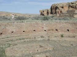 HD video woman explores kiva in Chaco Canyon NHP Stock Footage