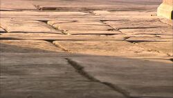 Sandal-clad feet run across a walkway made of worn stone. Stock Footage