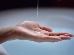 HD Super Slow-Mo: Liquid Soap On Woman's Hand Stock Footage