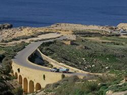 ARCH ROAD BRIDGE AND MEDITERRANEAN SEA Stock Footage