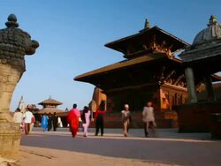 T/L, WS, ZI, people passing through Bhaktapur Durbar Square / Bhaktapur, Kathmandu Valley, Nepal Stock Footage