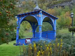 Hammerfest Norway cruise Hurtigruten downtown gazebo blue with polar bear logo and plants Stock Footage