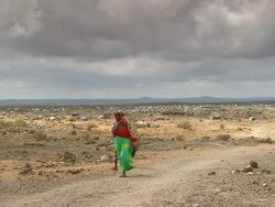 WS View of couple walking away from refugee camp / Djibouti Stock Footage