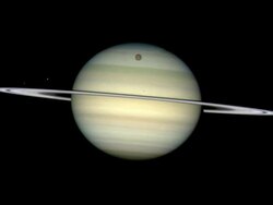 Timelapse footage showing four of Saturn's moons, as they circle the giant ringed planet, casting shadows on its cloud tops. Imaged by the Hubble Space Telescope in February 2009. Stock Footage
