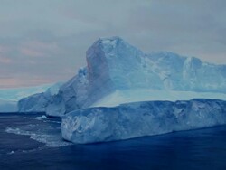 Blue Iceberg under brooding skies Stock Footage