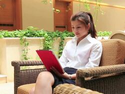 Young woman using a digital tablet in the car Stock Footage