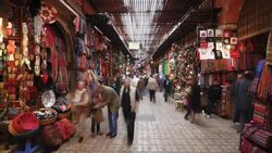 Shoppers maneuver through the Souq in Marrakech, Morocco. Stock Footage