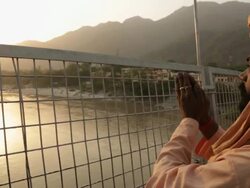 Man worshipping in river, Ganges River, Laxman Jhula, Rishikesh, Uttarakhand, India Stock Footage