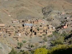 Old homes on cliffs in village in Atlas Mountains in Morocco Stock Footage