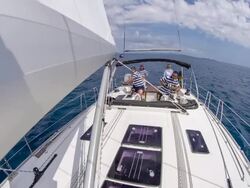 WS Boat Crew Navigating A Sailboat Stock Footage