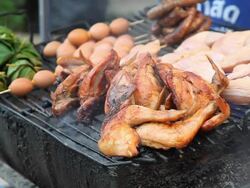 Chicken and egg on grill Stock Footage