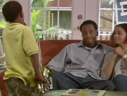 MS, PAN, couple listening to son (6-7) play saxophone in living room, Westfield, New Jersey, USA Stock Footage