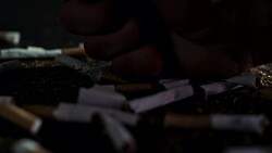 SLO MO Hand smashing cigarettes Stock Footage