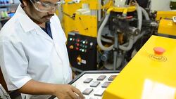 panning: young engineer  control  blown film extruder Stock Footage